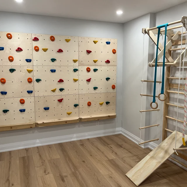 Custom Made 9 Panel Climbing wall using Upgraded Holds, with the Optional Ledge added on. Also pictured is a Custom made Swedish Ladder with accessories - these can be made nearly any size!