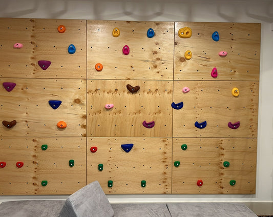 9 Panel Rock Climbing wall with Standard Holds, finished with a Polyurethane coating (Done by client - a great DIY project!)